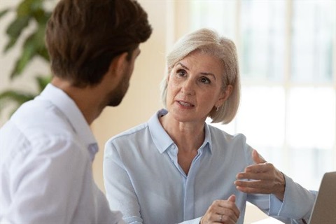 Business Consultant speaking with a business owner