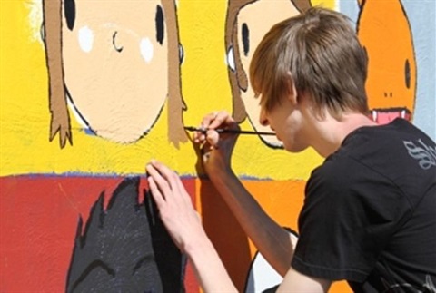 Person painting mural