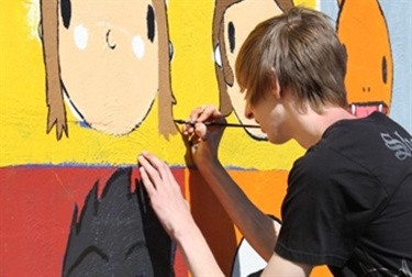 Person painting mural