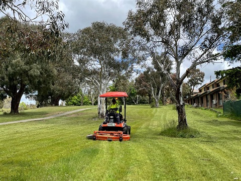 SMRC employee mowing 