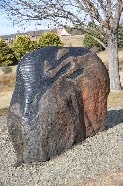 Close up of sculpted basalt rock public art titled Dignity and Permanence’