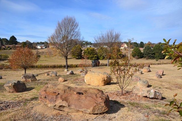 Sculpted basalt rock public art titled Dignity and Permanence’