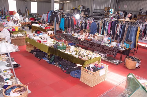 Interior of Cooma ScrapMart showing goods on display and browsing shoppers.