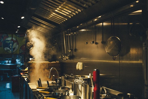An image of a commercial kitchen in the evening.