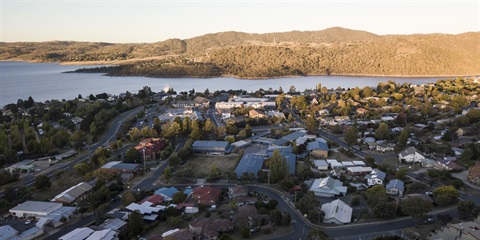 Aerial image overlooking central Jindabyne towards the lake at sunset