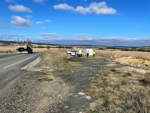 Crew and road plant establishing traffic controls on Mila Road in August 2023.