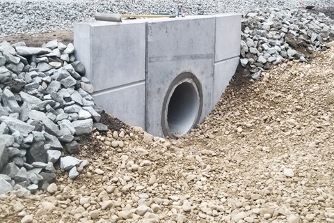 A newly installed culvert under infrastructure.