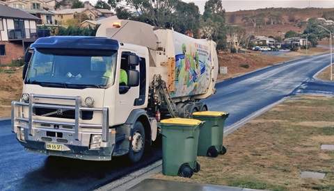 Collection truck picking up recycling bins on a Snowy Monaro street in the early morning