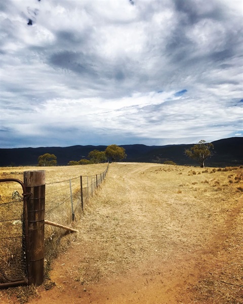 Rustic fence and mountains in Kalkite.JPG