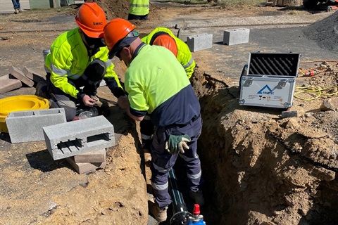 Water team members working on a water main extension, Smiths Lane Cooma