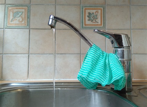 Water running from kitchen tap