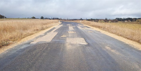 Mila Road pot holes.jpg